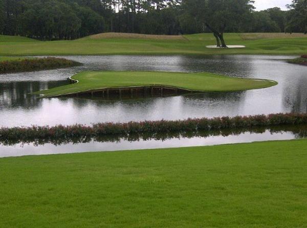 IanJamesPoulter's tweet photo. How's TPC Sawgrass 17th hole playing a bit tougher today than the tournament.  Canoe required. http://t.co/q9i6hpYy