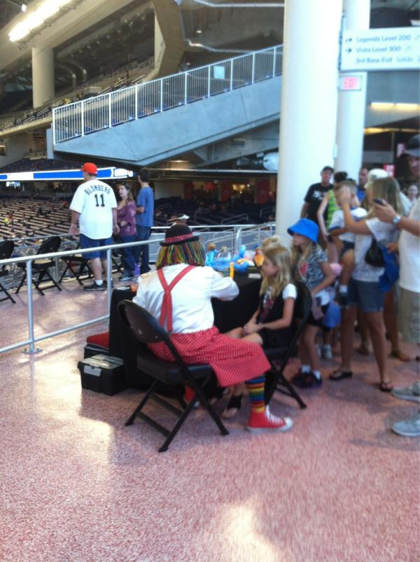 CDeNicola13's tweet image. There's a clown face painting, who also made a balloon cookie monster/Elmo, behind LF seats #Marlins #Philllies