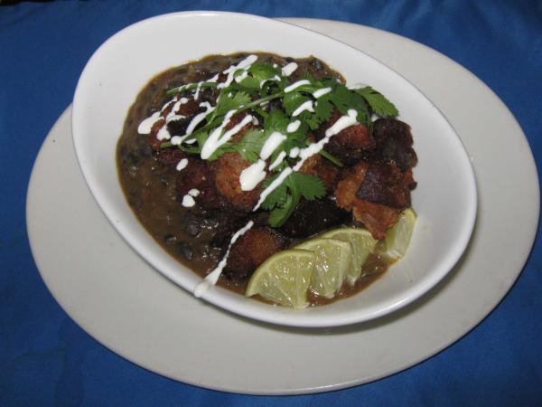 heechino's tweet photo. Braised ham hock and black beans, crisp pork belly, lime sour cream drizzle http://t.co/AEdryHsL