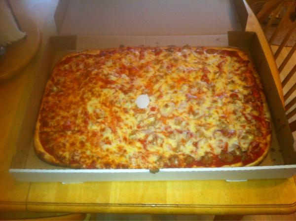 SpencerMost's tweet photo. My mom accidentally ordered a football stadium sized pizza! http://t.co/8EBtGeaM