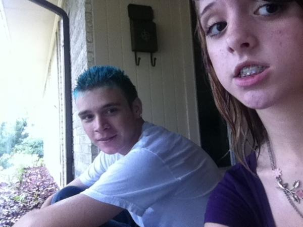 HannahSuzannee's tweet photo. Soaking wet from walking home in the rain with Tommy. cx We're under some random person's porch lmao http://t.co/Aa81a2Mu