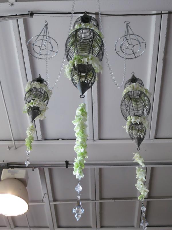Check out how we turned a plain Lumette vase into a romantic chandelier with white dendrobiums and clear crystals!