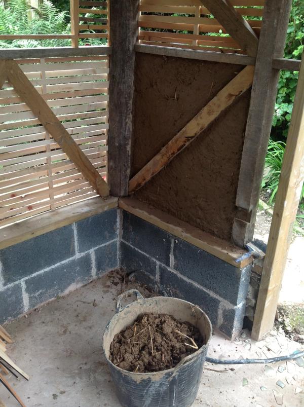 UnderhillCraig's tweet photo. The wattle and daub bit begins. One section done 16 more to go. Lime plaster to go on top. Looking good I think. http://t.co/cAR6LYDM