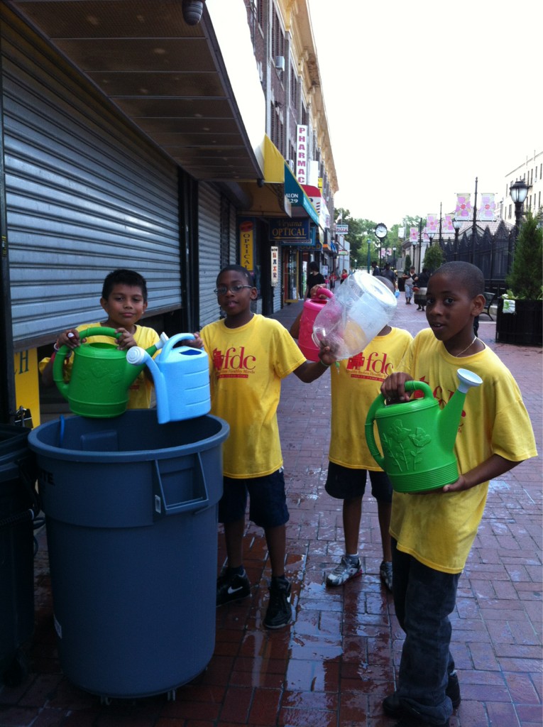 Flatbush Development Corporation On Twitter Fdc Summer Camp Kids Watering Plants In Newkirk Plaza Http T Co 4br7wg70