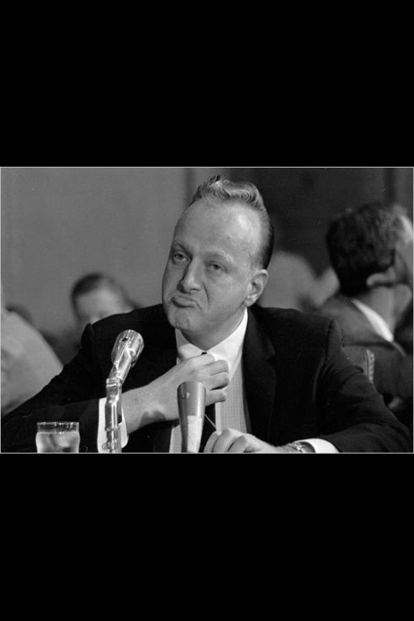 The new pose for men to counter the female duck pout. 
The mob boss!!