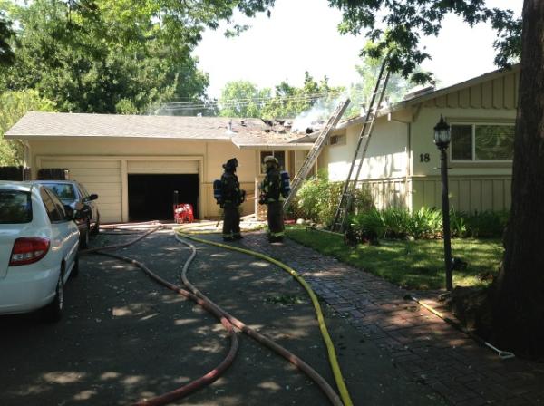 KatySweeny's tweet image. Looks like #ChicoFire, #CalFire has attic fire in Woodside Lane home mostly contained. Burned area still smoking.