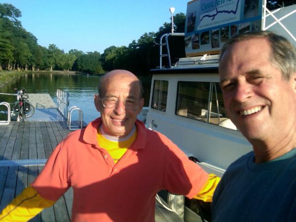 CanalNewYork's tweet photo. Cyclotour publisher Harvey Botzman and CANAL NY Captain JJ are the surf and turf twins at Bushnells Basin boat dock http://t.co/xX73Xry9