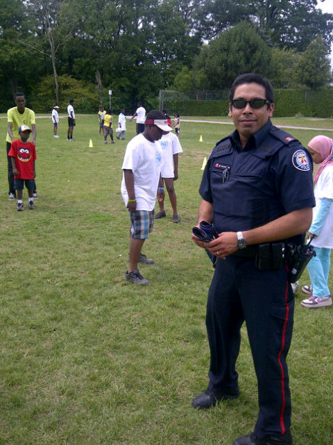 TorontoPolice's tweet photo. RT @PCGlennJones: @TPSCoaches #TPS teaching youth Sports &amp; Leadership at #forKICKS Sports Camp at #Topcliff P.S.! http://t.co/DvjP3zF0 ^tb
