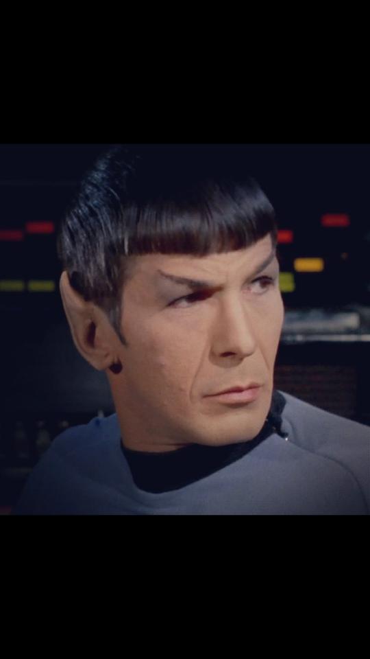 Leonard wearing his trademark white and gold shirt. #RIPSpock