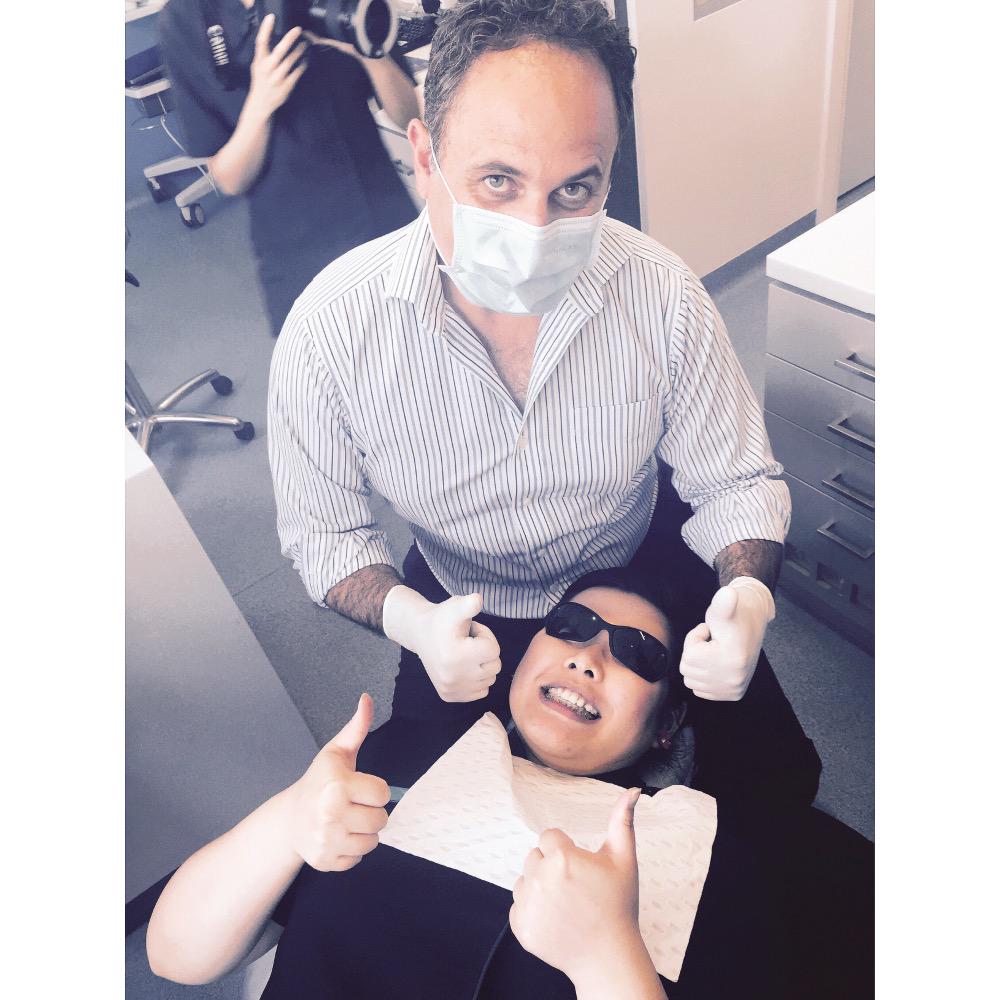 Dr Andrew Pepicelli putting braces on one of our amazing girls, Elaine. #SPortho #orthodontics #braces #smile
