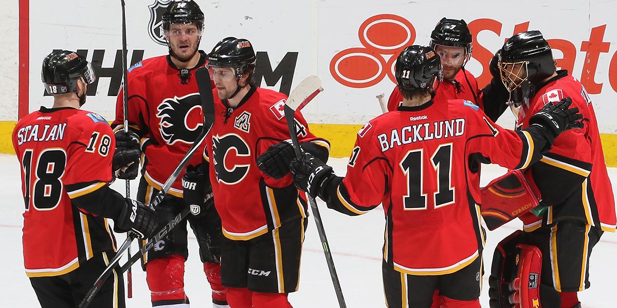 YOU CAN PUT IT IN THE WIN COLUMN! The #Flames down the #Bruins 4-3 in overtime! #Ignited #RingOfFire