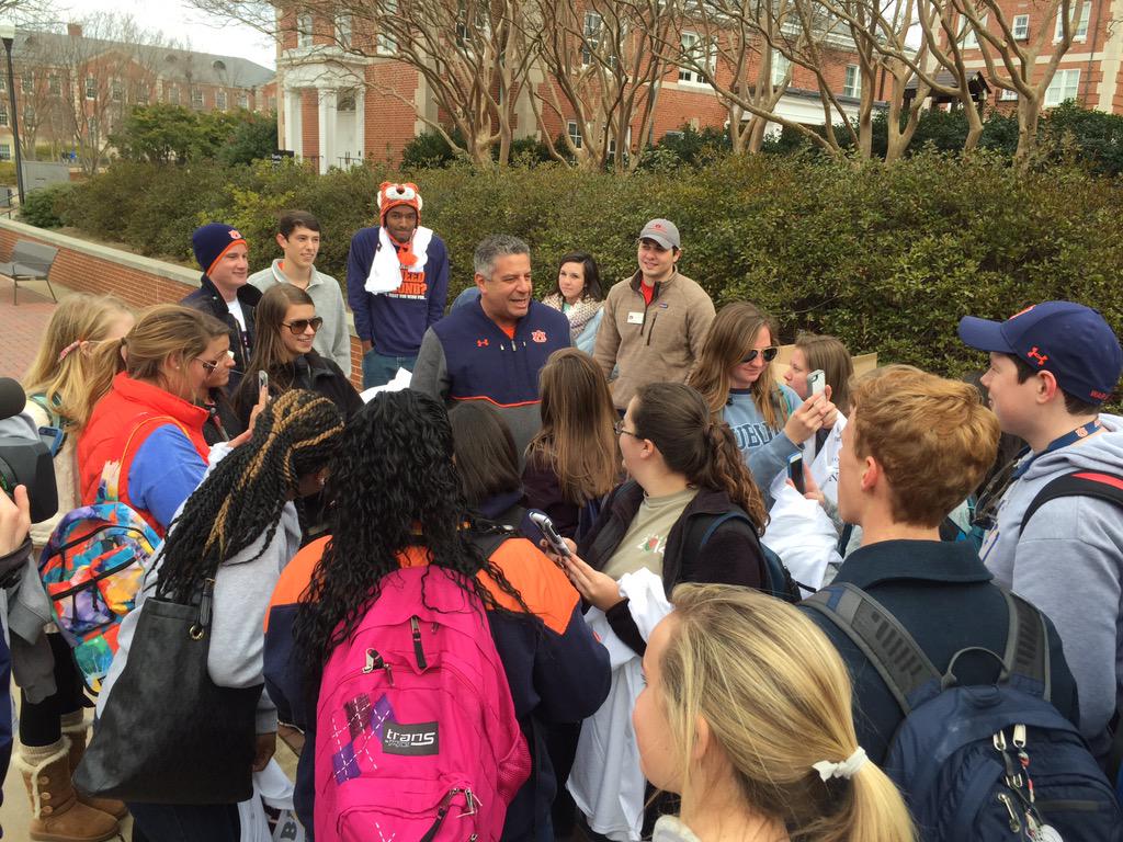 mobileauclub's tweet photo. We ❤ him! @AuburnMBB .@coachbrucepearl blocking traffic on the concourse, handing out t-shirts  #BeatBama http://t.co/jfCtArPMou