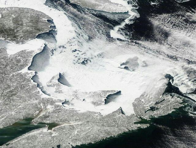 BoomerPEI's tweet image. Here is a shot from space of a our Snow-Covered and IcE Surrounded #PEI. Taken today from NASA.