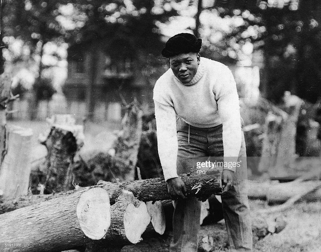 #JackJohnson #GalvestonGiant - Picking up a log of wood - Classic Photo - Circa.1922 - (FPG/GettyImages)