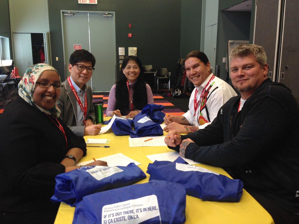 CBCOttawa's tweet photo. Human books at the St.Laurent branch chat about their day. #YOWHumanLibrary #cbcott #Ottawa http://t.co/GYmgbHQjbQ