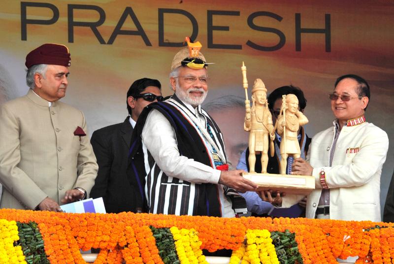 PM Narendra #Modi being presented a memento by CM of Arunachal Pradesh.
