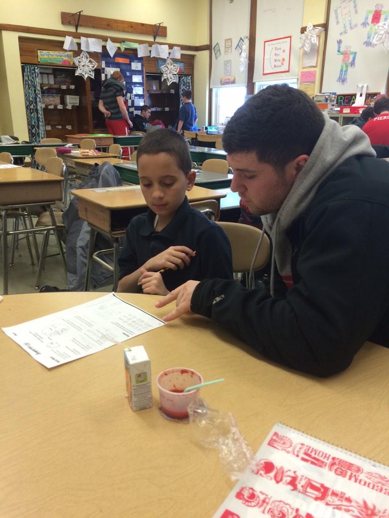 JakeBrown_35's tweet photo. @WPIFootball helping Burncoat Prep with their math homework! @bmarsh29 and Aaron Hartford working with the guys! http://t.co/EzztrkdPd2