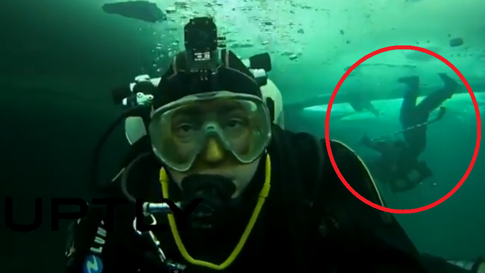 RT_com's tweet photo. Upside Down: Taking ice hockey to a whole new level - underwater in Siberia (VIDEO) http://t.co/2K0ia4PjH0 http://t.co/p5VbwgVIDC