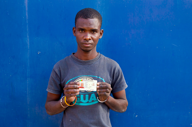 Refugees's tweet photo. Former stateless street child, &amp; talented artist Abou, proudly &amp; finally holds his Senegal ID http://t.co/Dq7B3vslv6 http://t.co/lXymmOM4mF