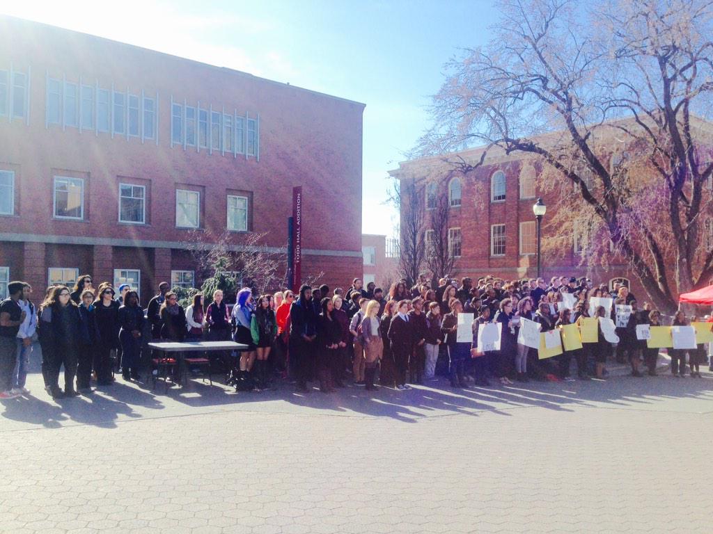 Students stand in silence at a Funeral for Ignorance #WakeUpWSU