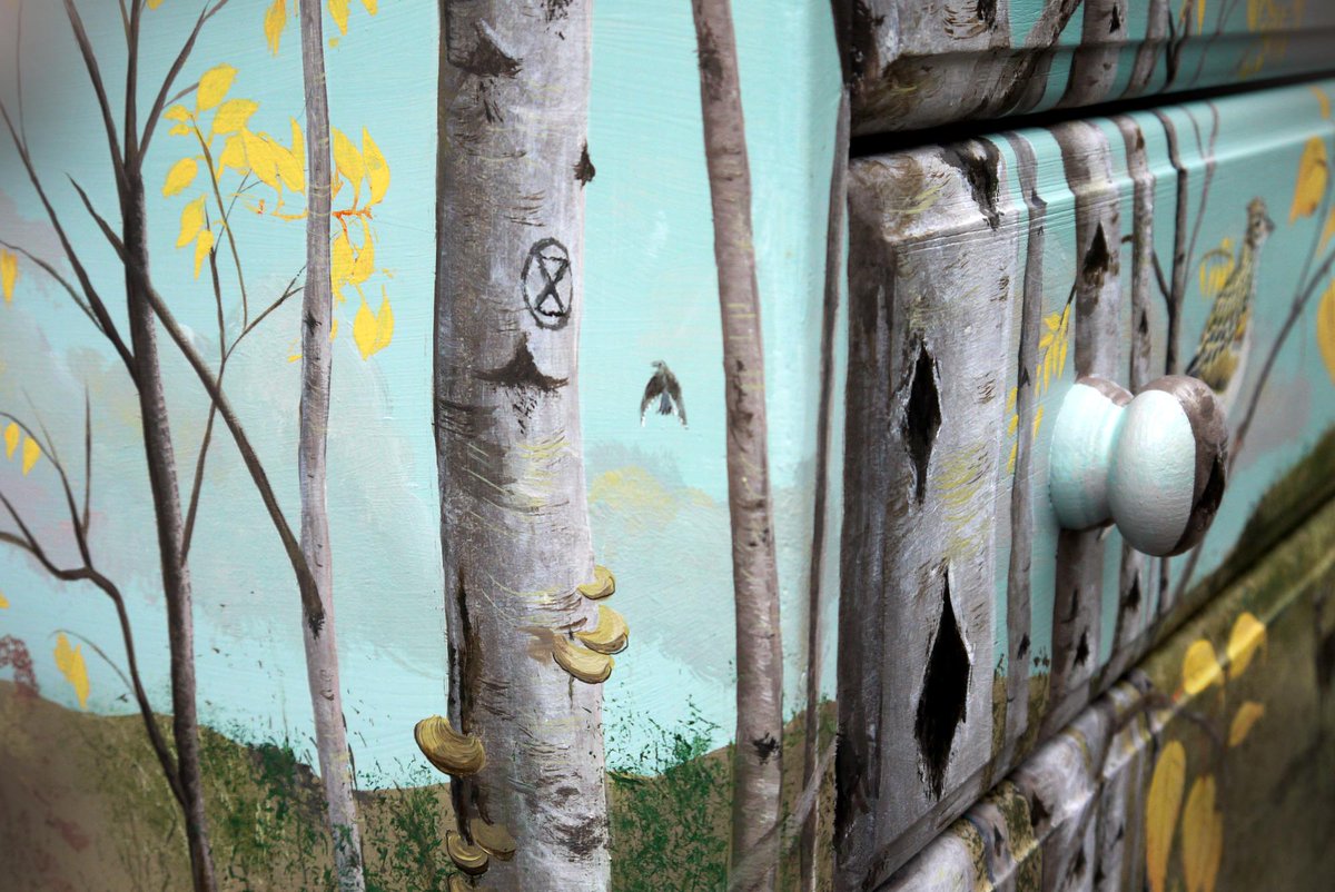 Chest of drawers painted with woodland scene of larks and birches and an #extinctionsymbol. zoografika.com/what