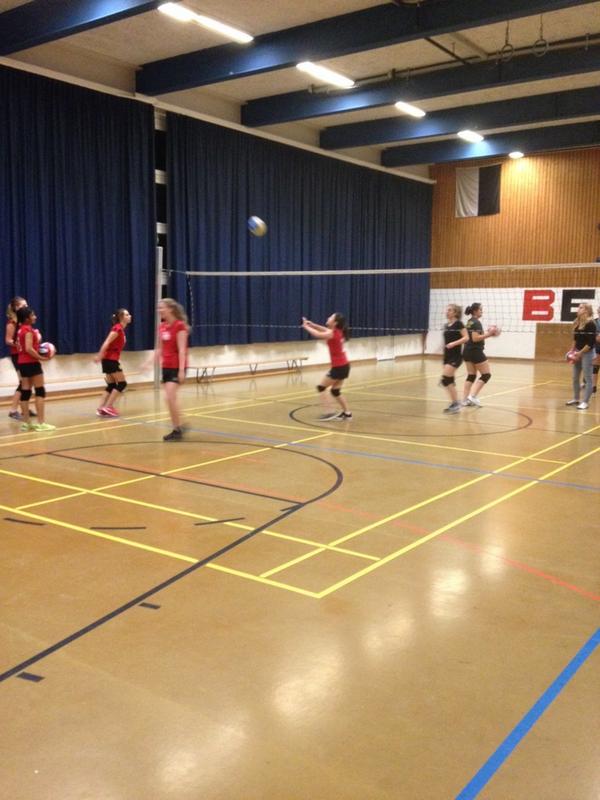 Girls volleyball team warming up. Home match vs Bern Club team.