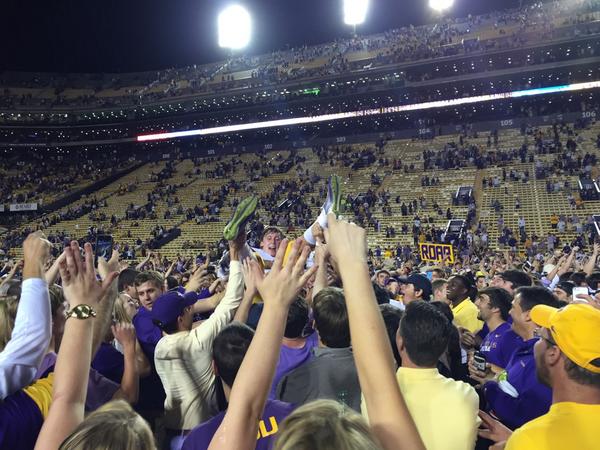 Sheadixon's tweet photo. So this happened. Trey Quinn crowd surfs in Tiger Stadium. http://t.co/IdEP92HI10
