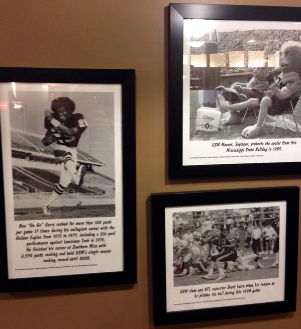 USMVoice's tweet photo. Love these 🏈USM pictures on the wall @Raising_Canes #SMTTT #ShowYourGold http://t.co/Q9bbZZ0ABe