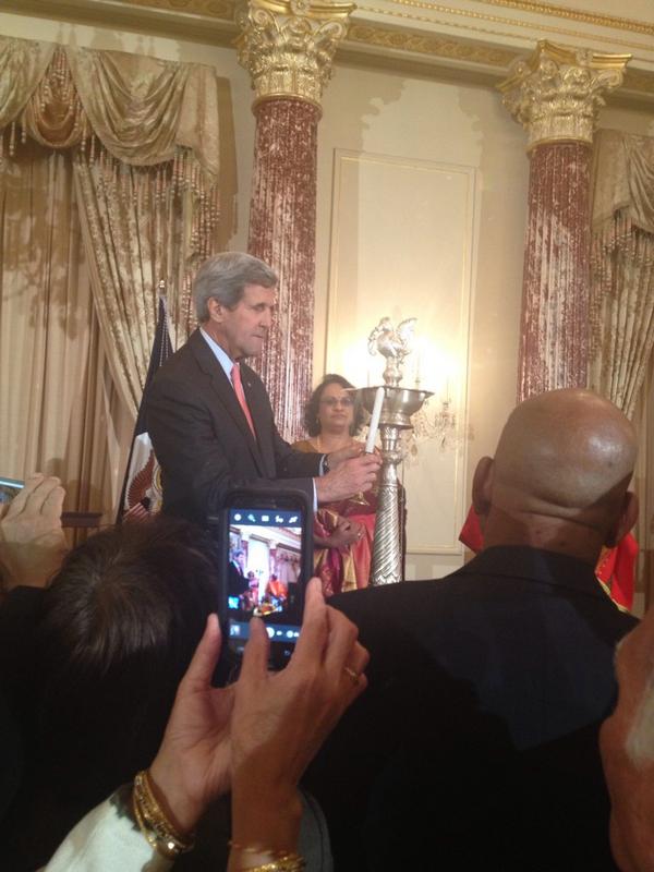 Secretary Kerry lighting a lamp at the first Diwali celebration at the State Department.