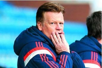 Loads of people are kicking Mark Wotte on the way out of the Hampden door.