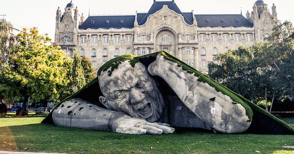 mymodernmet's tweet image. Gigantic Man Erupts from the Earth in this Spectacular Outdoor Sculpture bit.ly/12SkGzU