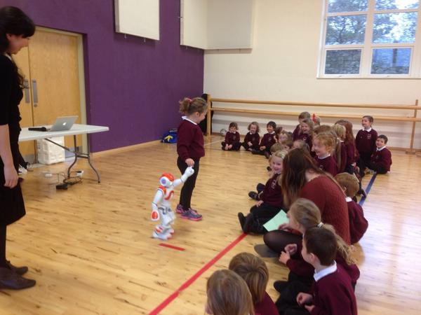 Aismry's tweet photo. Some pictures from our Code event today - Junior Infants bringing the Nao robot for a walk #Codeweek2014 http://t.co/KW6QwxL7H0