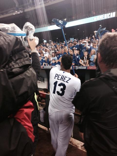 JeffPassan's tweet image. Salvador Perez is running around Kauffman Stadium, taking selfies with fans, carrying a KC logo'd broom.