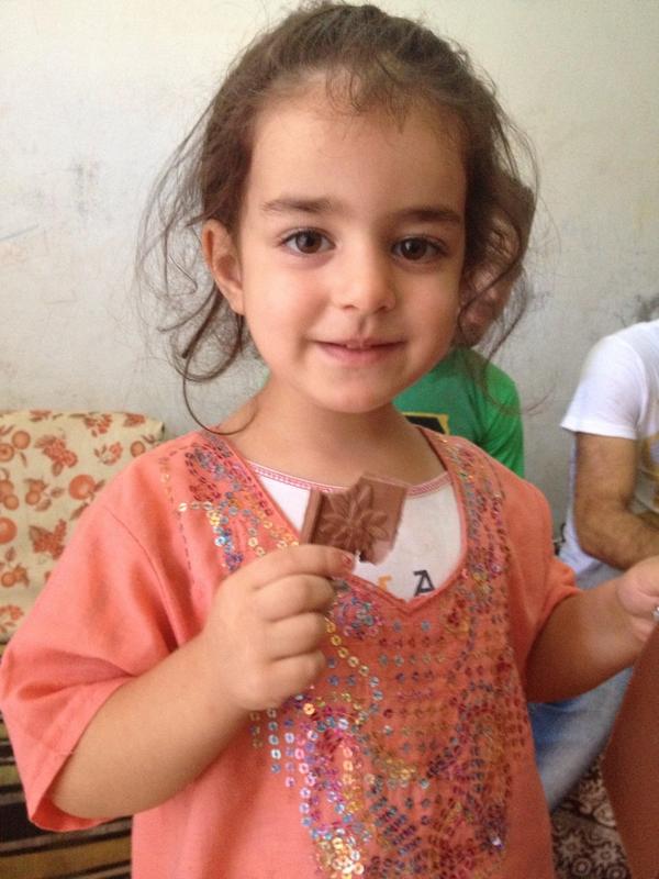 eujin2's tweet photo. Who can say 'no' to chocolate?!  Maysan, 4yo Syrian refugee girl, fell in love with chocolate! @Refugees http://t.co/LQOqs1zf68
