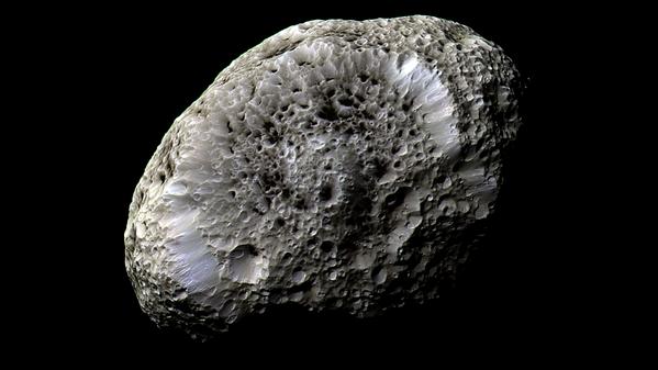 NASA's tweet photo. Bathed in a beam of particles from Saturn's chaotically tumbling moon Hyperion: http://t.co/fwphdDBthr @CassiniSaturn http://t.co/zdR0YSSiqH