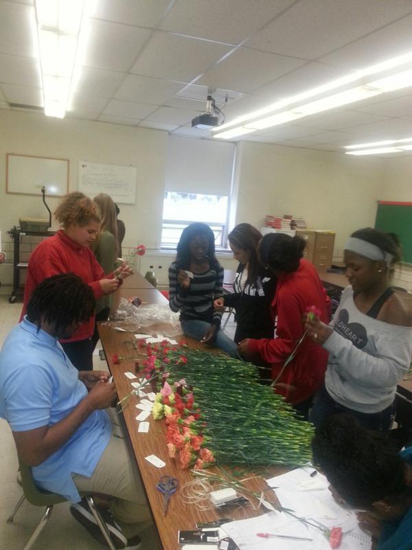 p_unity's tweet image. Mr.Lewis assisting Victoria, Jenna, Jayden, Alona and Briaka with the carnation prep.