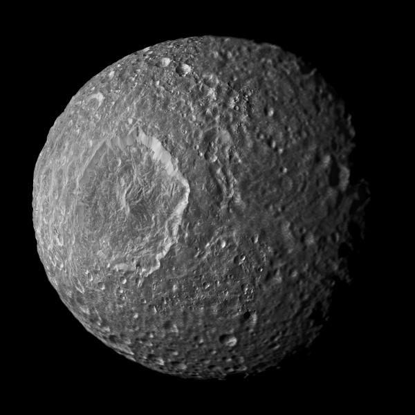 NASA's tweet photo. A hidden ocean or a 'fossil' core on Saturn icy moon Mimas? Details: http://t.co/f14fjnfliN @CassiniSaturn http://t.co/xH1vV3FR6h
