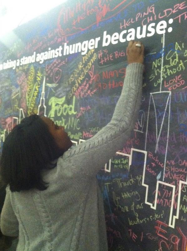 FoodBank4NYC's tweet photo. .@FoodBank_Prez taking a #standagainsthunger and signing the #hungerwall @NYCWFF! #endhunger #NYCWFF http://t.co/qrpyTyWNuU