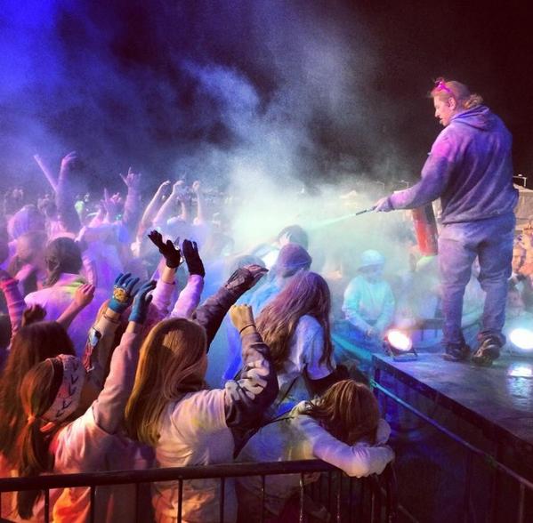 ColorFunFest's tweet photo. #EPICREPOST from @AdventureMom of our dj/emcee @jamie_leibert blasting the front of the crowd with color last night! http://t.co/kzhAjOU8UP