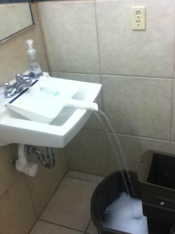 We came across this idea of using a dustpan to fill up a container when the container is to big to fit under the tap.