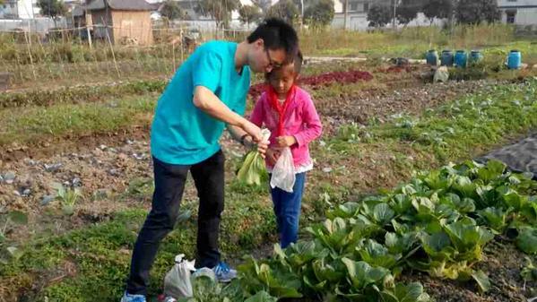 .<a href="/hiltonhotels/">Hilton Hotels</a> #volunteer with shanghai youth learning to #compost their #coffee grounds at #organic farm.