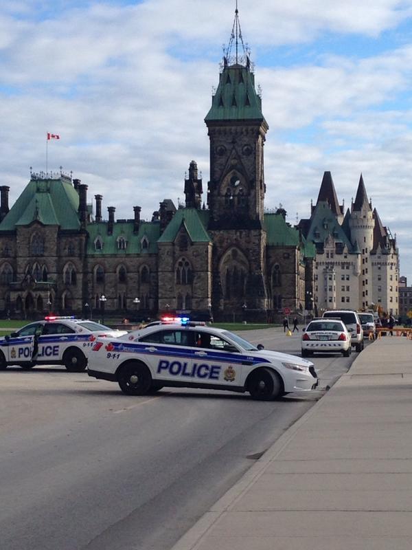 TondaMacC's tweet photo. Cops converging by West Block. http://t.co/wnMRhnZy6f