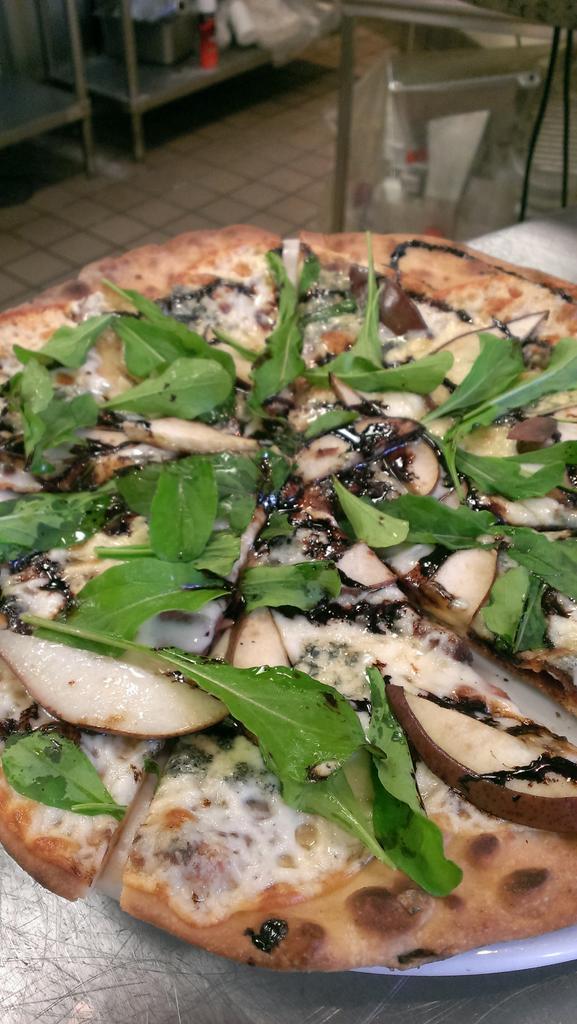 Fire-grilled #pizza . It's what's for #lunch. <a href="/calhounchamber/">Calhoun Cty Chamber</a> #eatlocal #freshArugula #farmtotable