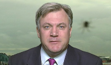 guardian's tweet photo. Ed Balls photobombed by spider on BBC News http://t.co/Pie5g2Xoyh http://t.co/KYJ1s9IioM