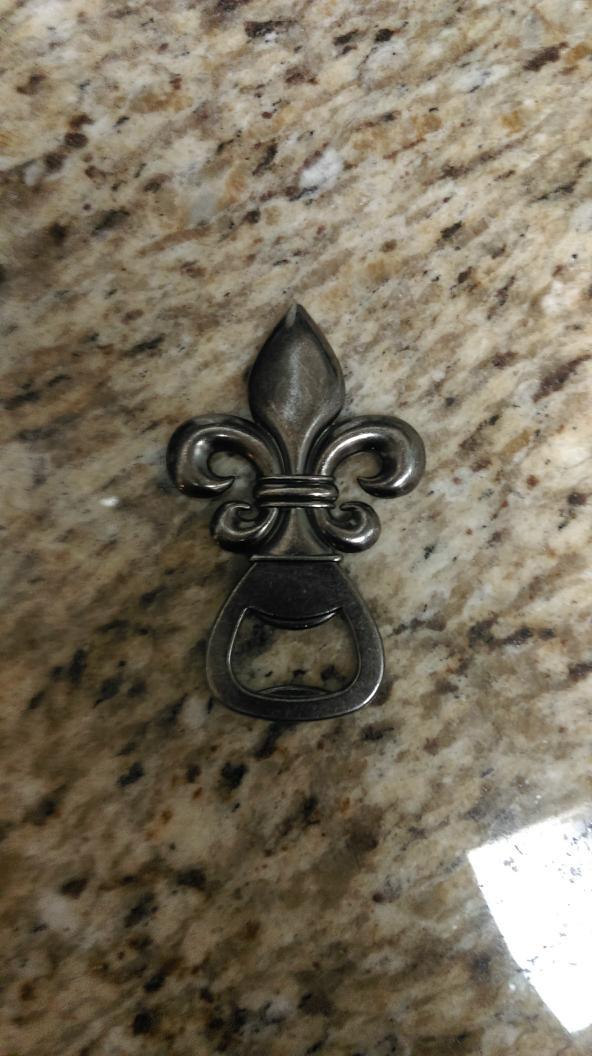 WrapWithAsh's tweet photo. After all these years you still know the way to my heart ❤ @CrooklynMMA .Fleur de Lis and it opens my beer #church http://t.co/31n5dMxFOZ