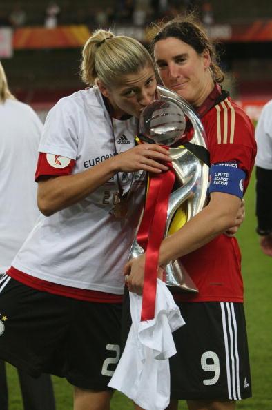 Birgit Prinz with baby Schmiddo at Euro 2009. and once again, Happy Birthday Biggi ! 