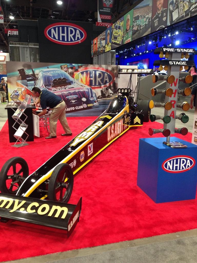 LiveAtSEMA's tweet photo. Be sure to stop by the @NHRA booth with @shoeracing dragster on display #LivefromSEMA http://t.co/y9c5LzliAi