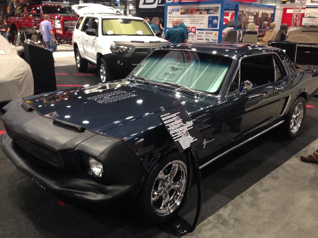 LiveAtSEMA's tweet photo. A classic 1965 @Ford #mustang coupe in the @Covercraft1965 booth #LivefromSEMA http://t.co/zmv8z5uAmp
