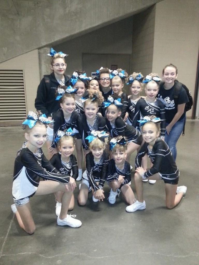 TakeFlightCheer's tweet photo. First comp of the cheer season and you all are rockin it! #JAMfestTopeka #TeamworkMakesTheDreamWork http://t.co/qtslJ1x3yc