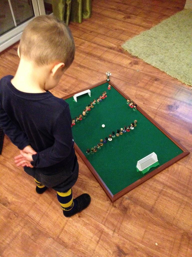 A Young Boy Held A Minutes Silence In Front Of A Toy Football Set At ...